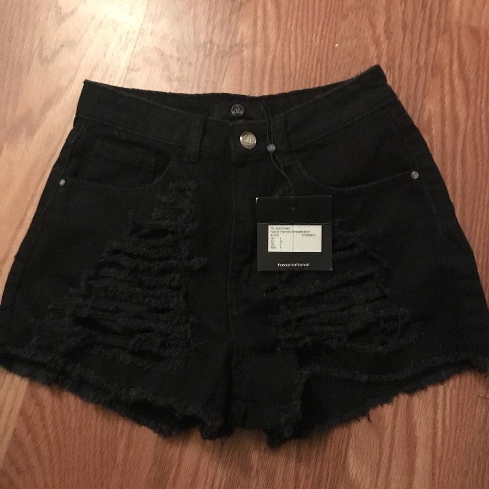 Missguided festival high waist shredded shorts